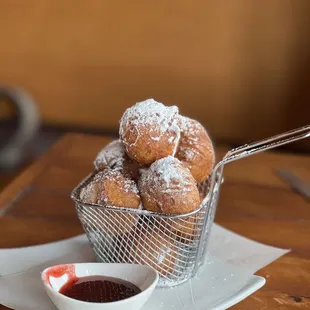 Beignets with strawberry sauce