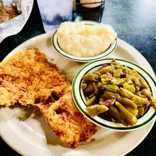 Chicken fried steak with green beans and mashed potatoes