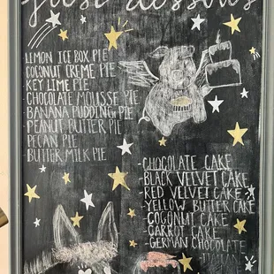 a chalkboard with a list of desserts