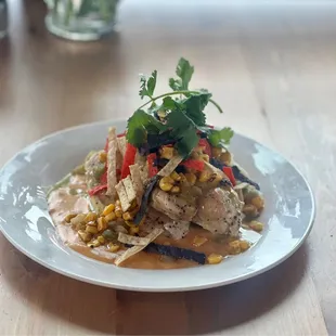 a plate of food on a wooden table