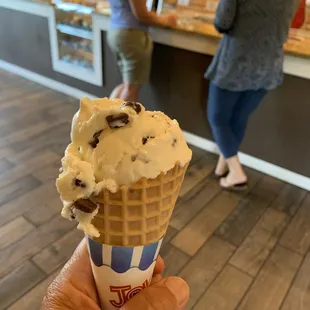 Single dip of Guernsey ice cream on a waffle cone. Soooo Good!
