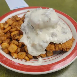 Breaded tenderlion on biscuit and gravy