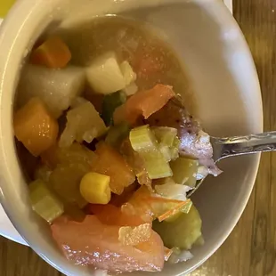 Veggies in water with artificial seasoning- suppose to be veggie soup.