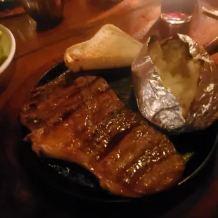 Steak potatoe and half a slice of bread