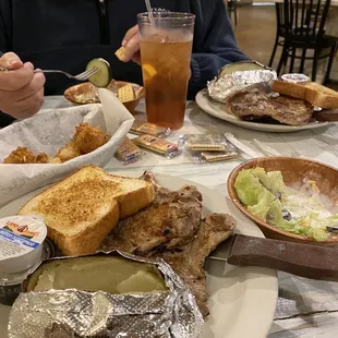 a man sitting at a table with a plate of food