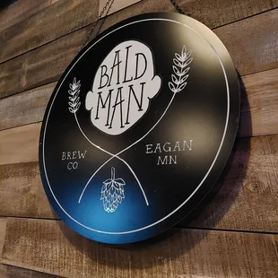 a sign for bald man