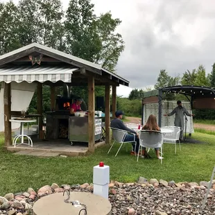 The outdoor pizza oven and open mic.