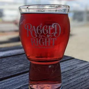 a glass of beer on a table