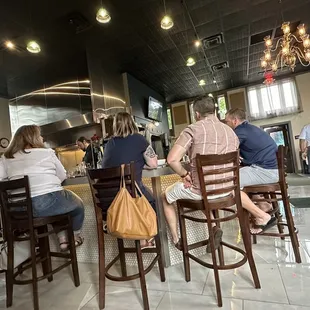 people sitting at the bar