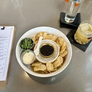 Caviar and chips with an After Work Whiskey Sour