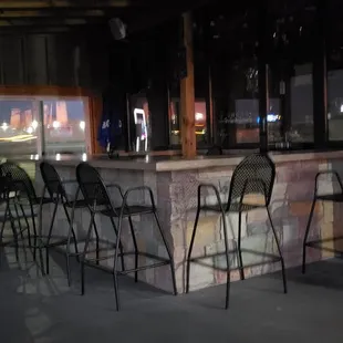 a bar with chairs
