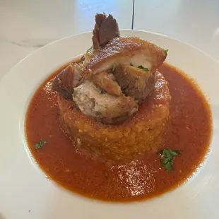 Mofongo de chicharrones with red tomato sauce