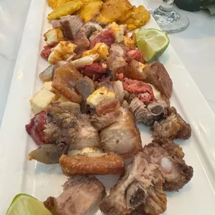 Picalonga, a sampler platter consisting of pork belly, cheese, pork sausage, salami, and fried plantains