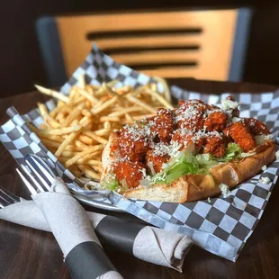 Crispy buffalo chicken sandwich with French fries