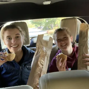 Enjoying a baguette on the way to the gathering place.
