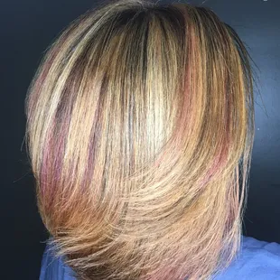 Custom coloring.. highlights &amp; lowlights . Silk press .