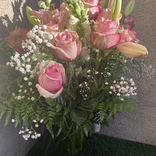 The tiny overpriced bouquet I got with only a few roses and two lilies. No carnations.