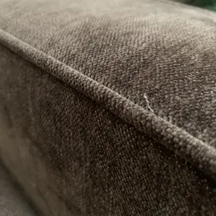 Loose threads on sofabed and chair
