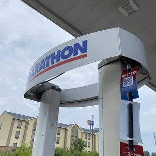 a gas station with a gas station sign