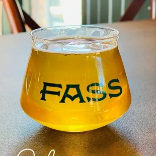 a glass of beer on a table