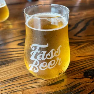 a glass of beer on a table