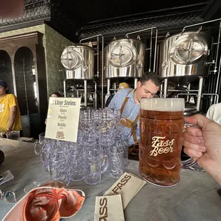 a man holding a mug of beer