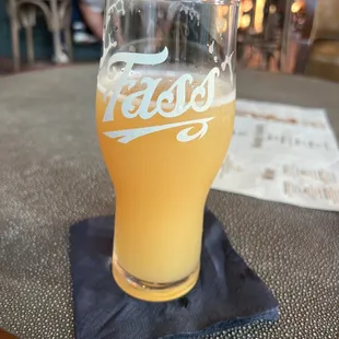 a glass of beer on a table