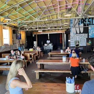 people sitting at tables in a restaurant