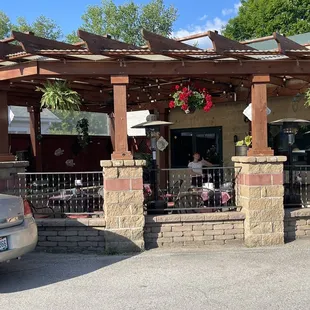 Cute outside dining under a pergola.