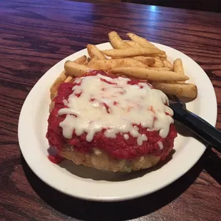 a chicken parmesan sandwich and french fries