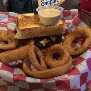 a sandwich and onion rings