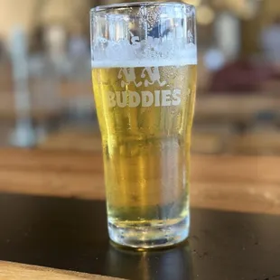 a pint of beer on a table
