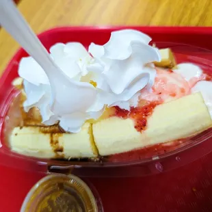 a banana split with whipped cream