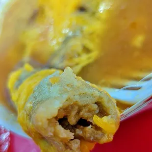 a close up of a fork with a bite taken out of it