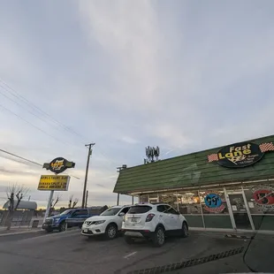 cars parked in front of the restaurant