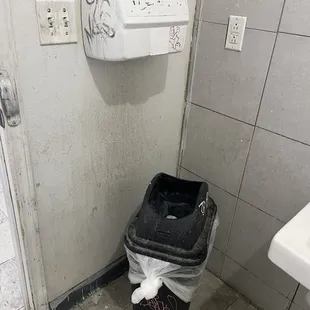 a trash can in a bathroom