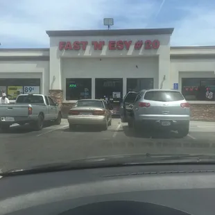 Store Front of the Fast 'N' Esy #20. The gas station is Chevron gas.