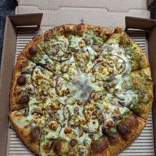 Custom pizza - pesto, feta, onion, garlic, and mushroom