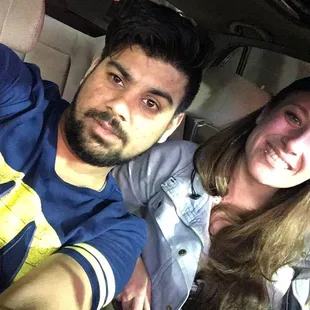 a man and woman taking a selfie