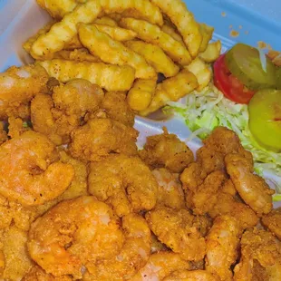a tray of fried shrimp and fries