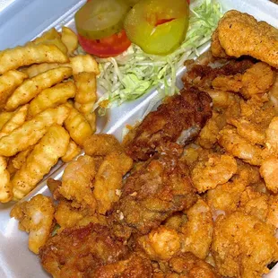 a tray of fried chicken and french fries
