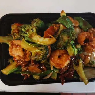 a plate of food with broccoli and shrimp