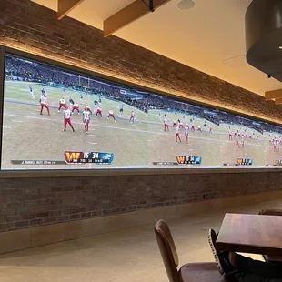 Large TV screens along one wall