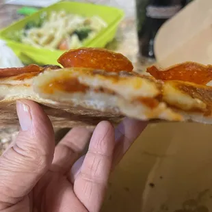 Doughy unfully cooked pizza slice