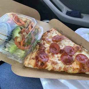Slice of pepperoni with half salad