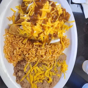 Heaven on a plate, rolled tacos, rice and beans. My favorite