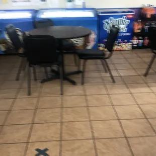 a table and chairs in a fastway