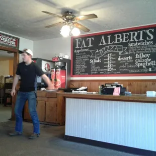 a man standing in front of the counter