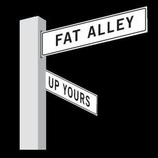 a street sign for fat alley