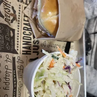 a sandwich and coleslaw